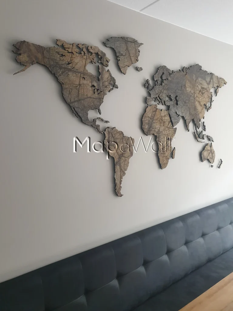 Brown marble world map installed on a wall above a sofa