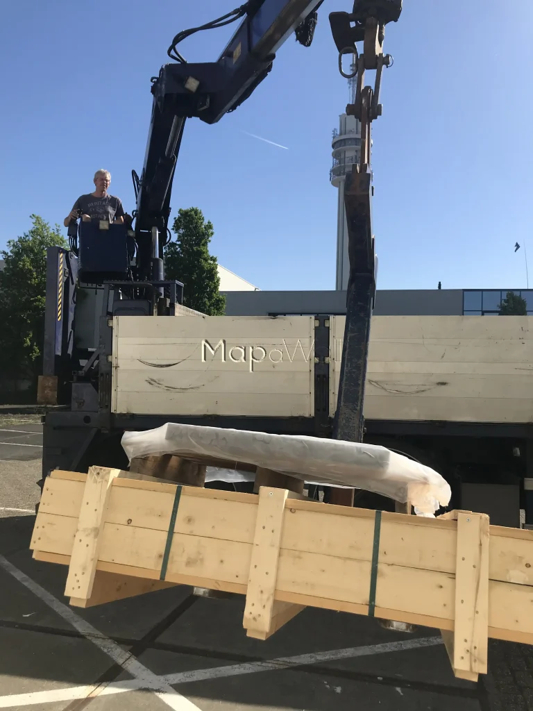 The marble world map arriving by truck